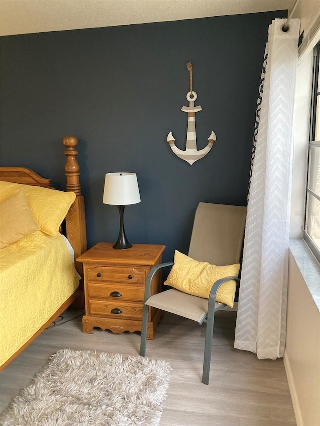 7951 58th Ave N Unit 308, Saint Petersburg, FL 33709 - bedroom featuring wood finished floors and baseboards