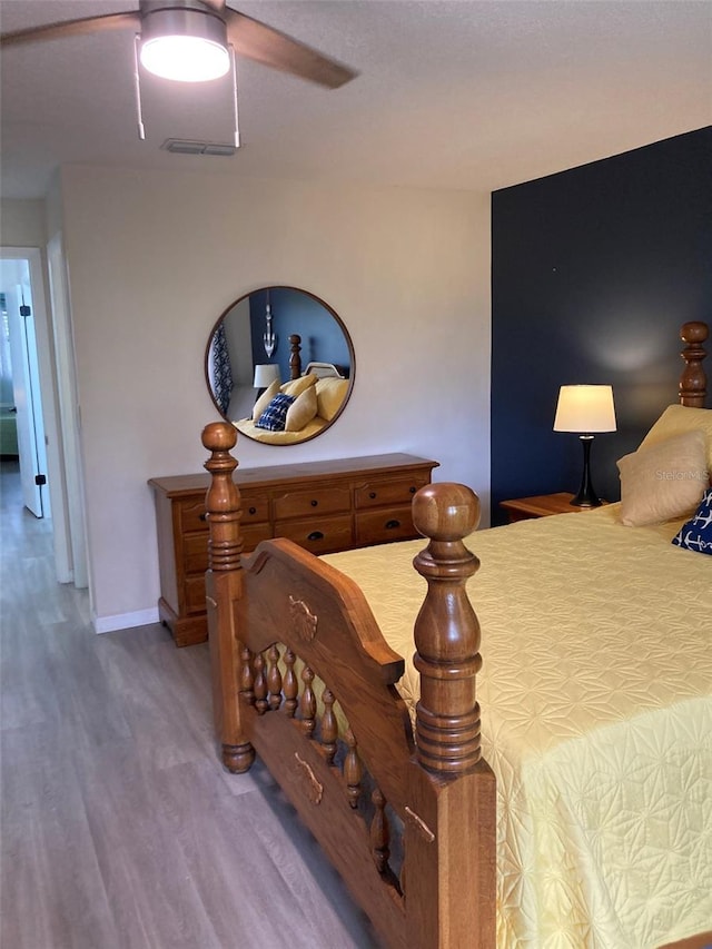 7951 58th Ave N Unit 308, Saint Petersburg, FL 33709 - bedroom featuring wood finished floors and a ceiling fan