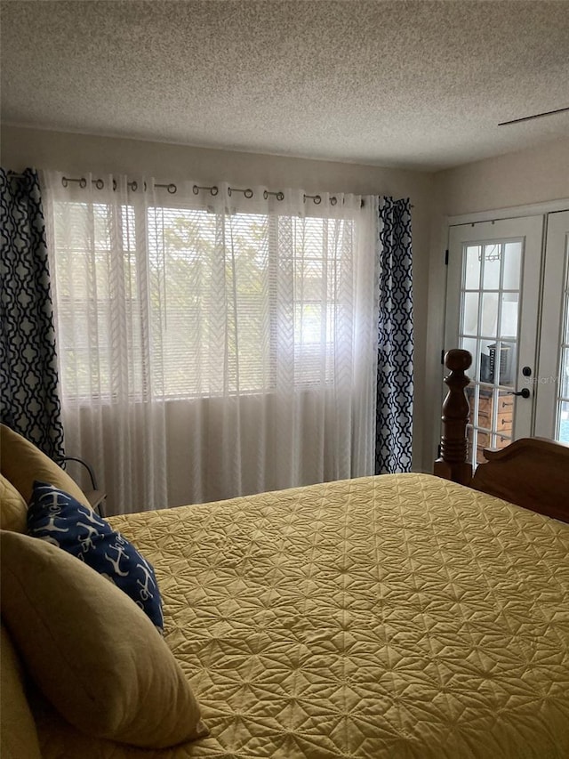 7951 58th Ave N Unit 308, Saint Petersburg, FL 33709 - bedroom with a textured ceiling