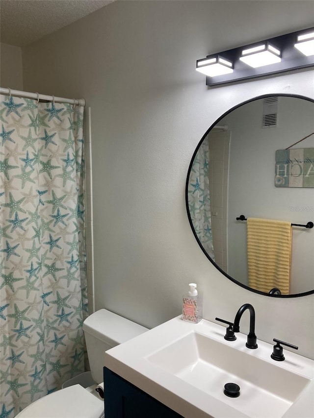 7951 58th Ave N Unit 308, Saint Petersburg, FL 33709 - bathroom featuring vanity, toilet, and curtained shower