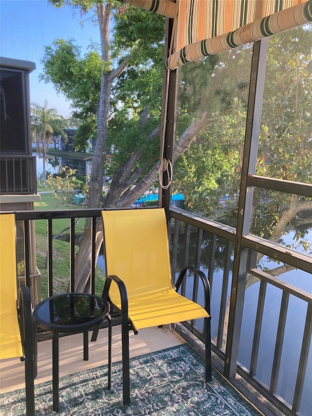 7951 58th Ave N Unit 308, Saint Petersburg, FL 33709 - sunroom / solarium featuring a water view