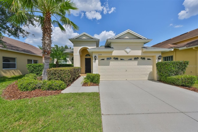 3315 Granite Ridge Loop, Land O Lakes, FL 34638 - view of front of property with concrete driveway, stucco siding, and a garage