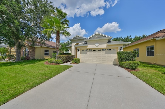 3315 Granite Ridge Loop, Land O Lakes, FL 34638 - view of front of property with concrete driveway, stucco siding, an attached garage, and a front yard