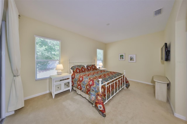 3315 Granite Ridge Loop, Land O Lakes, FL 34638 - bedroom with light colored carpet, baseboards, and visible vents