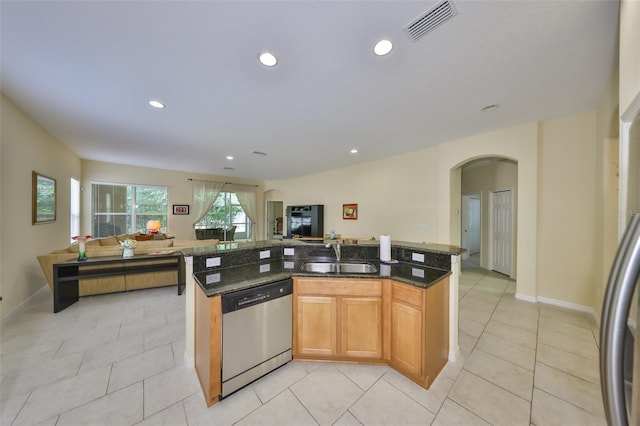 3315 Granite Ridge Loop, Land O Lakes, FL 34638 - kitchen featuring stainless steel dishwasher, visible vents, open floor plan, and a sink