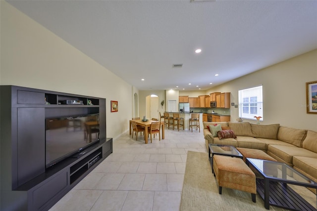 3315 Granite Ridge Loop, Land O Lakes, FL 34638 - living area with light tile patterned floors, visible vents, arched walkways, and recessed lighting