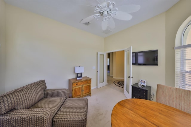 3315 Granite Ridge Loop, Land O Lakes, FL 34638 - living area with light carpet, baseboards, visible vents, and ceiling fan
