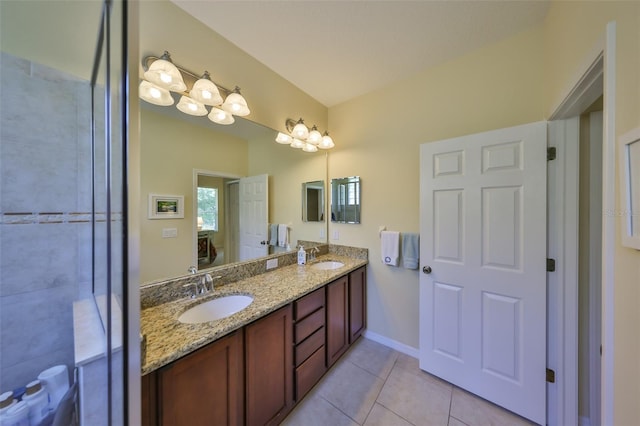 3315 Granite Ridge Loop, Land O Lakes, FL 34638 - bathroom with a sink, double vanity, baseboards, and tile patterned floors