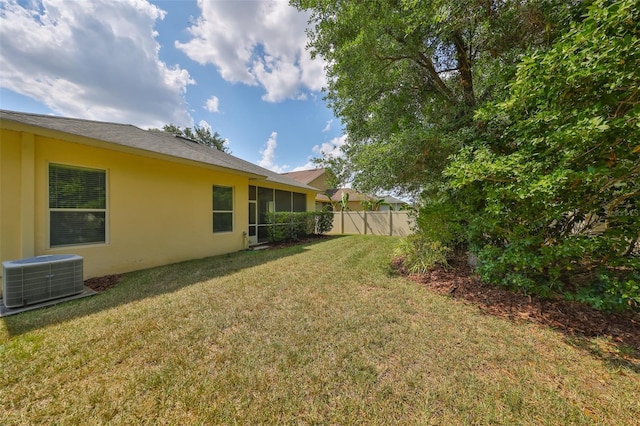 3315 Granite Ridge Loop, Land O Lakes, FL 34638 - view of yard with central air condition unit, fence, and a sunroom