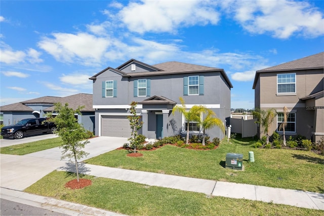 view of front of property with a front lawn, a garage, driveway, stucco siding, and fence