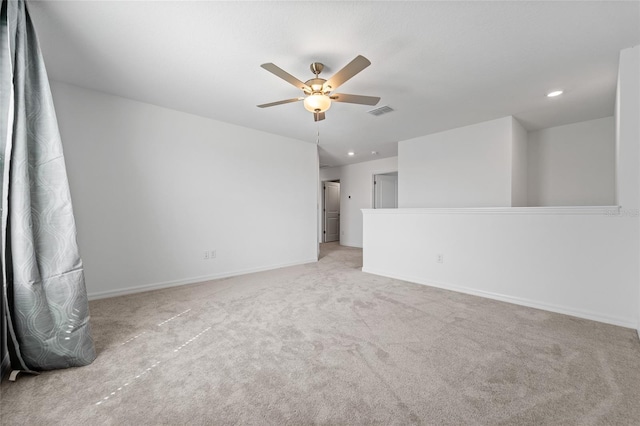 carpeted spare room featuring baseboards, visible vents, a ceiling fan, and recessed lighting