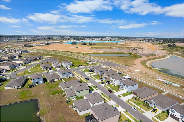aerial view with a water view and a residential view