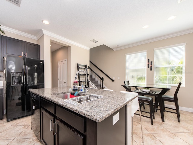 311 Vista Cruiser Ln, Oldsmar, FL 34677 - kitchen featuring black appliances, a sink, light stone counters, light tile patterned floors, and crown molding