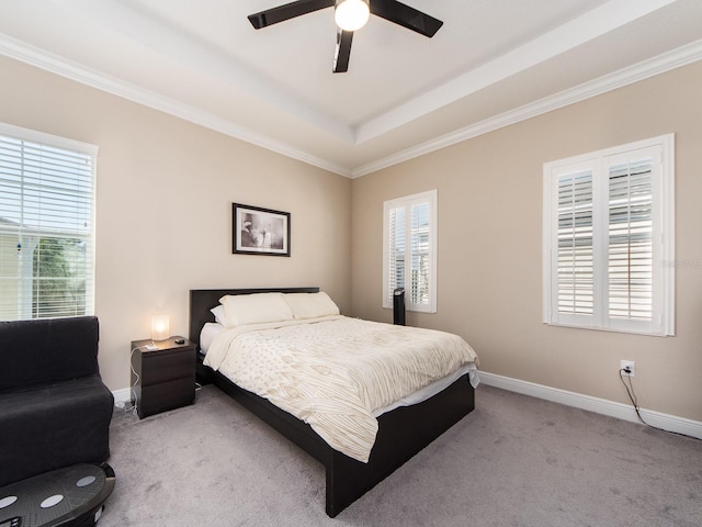 311 Vista Cruiser Ln, Oldsmar, FL 34677 - carpeted bedroom with a tray ceiling, baseboards, ornamental molding, and ceiling fan
