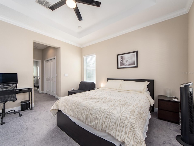 311 Vista Cruiser Ln, Oldsmar, FL 34677 - bedroom featuring carpet, a tray ceiling, baseboards, a closet, and ornamental molding