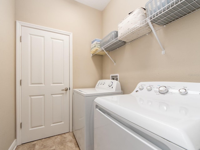 311 Vista Cruiser Ln, Oldsmar, FL 34677 - washroom featuring washer and clothes dryer and baseboards