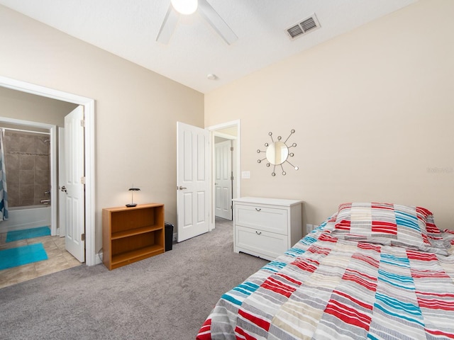 311 Vista Cruiser Ln, Oldsmar, FL 34677 - carpeted bedroom featuring ensuite bathroom and ceiling fan