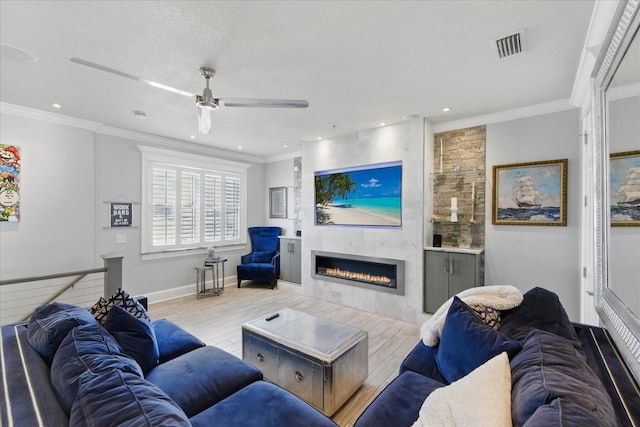 3111 W De Leon St Unit 8, Tampa, FL 33609 - living room with a fireplace, wood finished floors, ceiling fan, crown molding, and recessed lighting