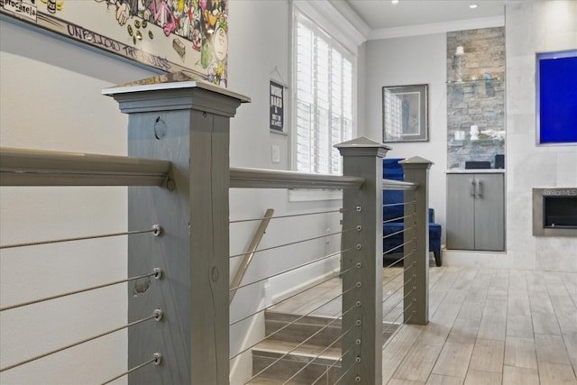 3111 W De Leon St Unit 8, Tampa, FL 33609 - detailed view of ornamental molding, wood finished floors, and a tile fireplace
