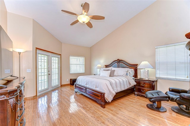 bedroom with high vaulted ceiling, access to outside, french doors, a ceiling fan, and light wood-style flooring