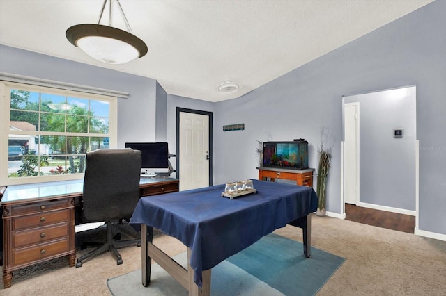 recreation room featuring baseboards and light carpet