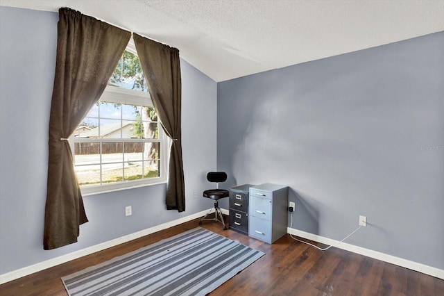 home office with baseboards, dark wood-style flooring, and lofted ceiling