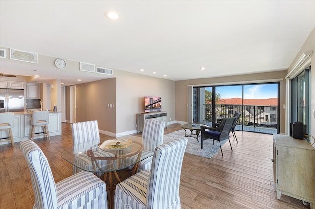 433 Mariner Dr Unit 433, Tarpon Springs, FL 34689 - dining area featuring visible vents, baseboards, and light wood-type flooring