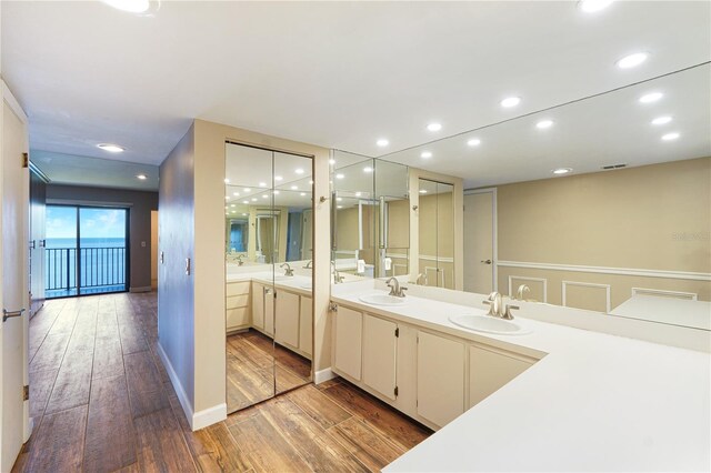 433 Mariner Dr Unit 433, Tarpon Springs, FL 34689 - bathroom with a sink, double vanity, and hardwood / wood-style floors