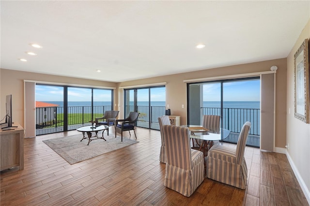 433 Mariner Dr Unit 433, Tarpon Springs, FL 34689 - dining room with a water view, recessed lighting, and wood finished floors
