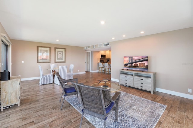 433 Mariner Dr Unit 433, Tarpon Springs, FL 34689 - living room featuring baseboards, recessed lighting, wood finished floors, and visible vents