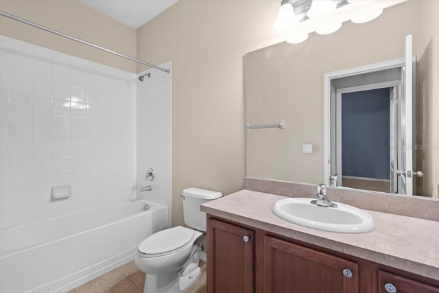 full bathroom with tile patterned floors, toilet, tub / shower combination, and vanity