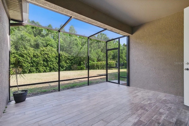 unfurnished sunroom featuring plenty of natural light