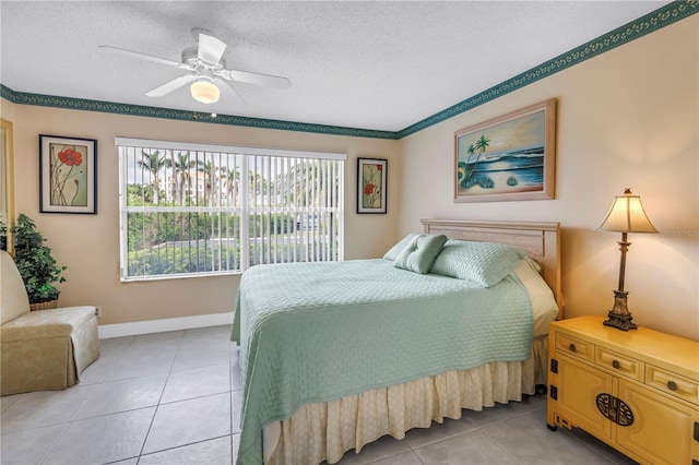 6011 Bahia Del Mar Blvd Unit 158, Saint Petersburg, FL 33715 - bedroom featuring light tile patterned flooring, a textured ceiling, a ceiling fan, and baseboards