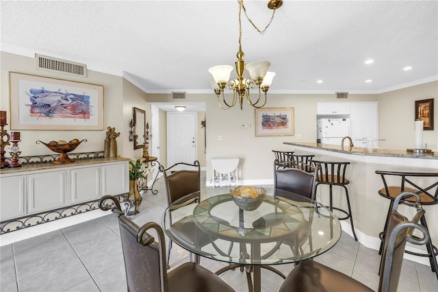 6011 Bahia Del Mar Blvd Unit 158, Saint Petersburg, FL 33715 - dining space featuring a textured ceiling, light tile patterned floors, ornamental molding, a chandelier, and recessed lighting