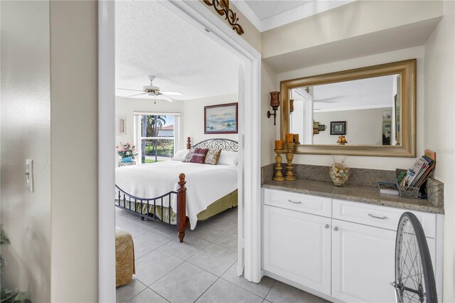6011 Bahia Del Mar Blvd Unit 158, Saint Petersburg, FL 33715 - bedroom featuring light tile patterned floors and a ceiling fan