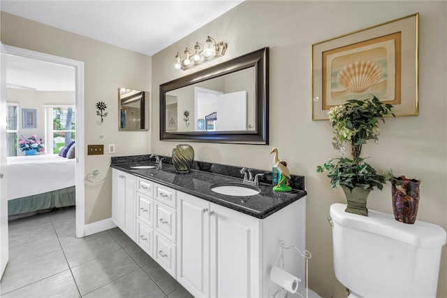 6011 Bahia Del Mar Blvd Unit 158, Saint Petersburg, FL 33715 - ensuite bathroom with double vanity, tile patterned flooring, toilet, and baseboards