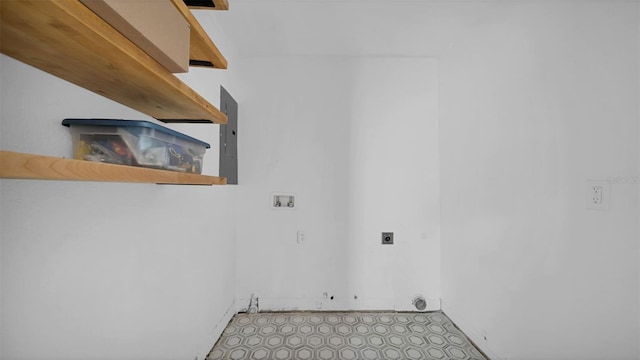 clothes washing area with laundry area, hookup for a washing machine, electric panel, and electric dryer hookup