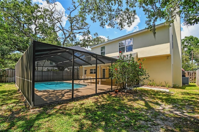 back of property with a fenced backyard, a patio, stucco siding, and a fenced in pool