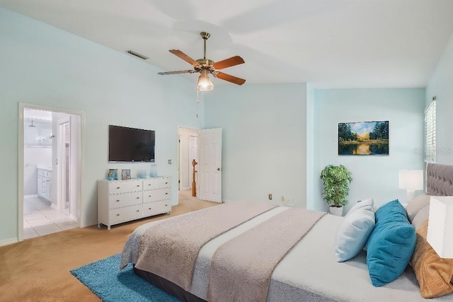 carpeted bedroom with a ceiling fan, high vaulted ceiling, ensuite bathroom, visible vents, and baseboards