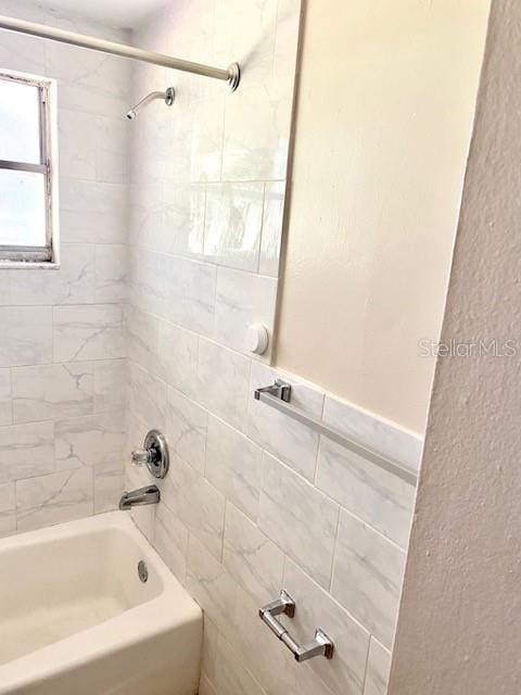 bathroom with shower / tub combination