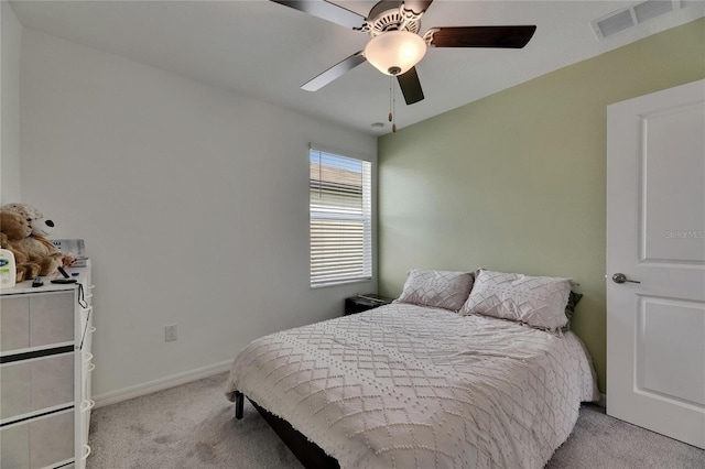 bedroom featuring carpet floors, a ceiling fan, baseboards, and visible vents