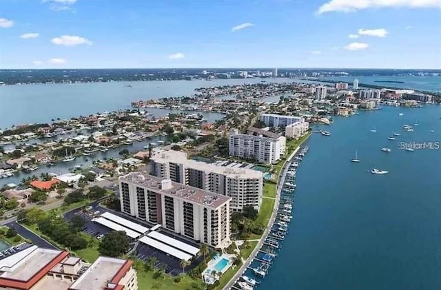 drone / aerial view with a view of city and a water view
