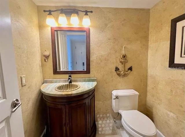 half bath with vanity and toilet