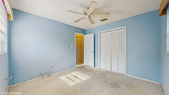 623 Park Cir Unit 623, Bradenton, FL 34207 - unfurnished bedroom with a textured ceiling, carpet, a closet, and visible vents