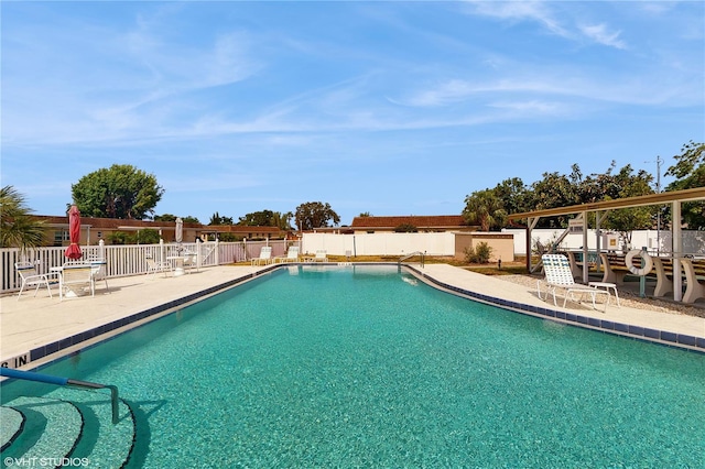 623 Park Cir Unit 623, Bradenton, FL 34207 - community pool featuring a fenced backyard and a patio area