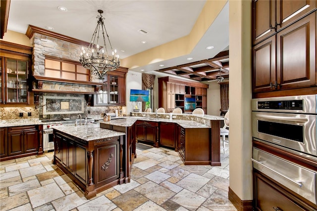 1102 Merry Water Dr, Lutz, FL 33548 - kitchen featuring stone tile flooring, recessed lighting, coffered ceiling, appliances with stainless steel finishes, and a warming drawer