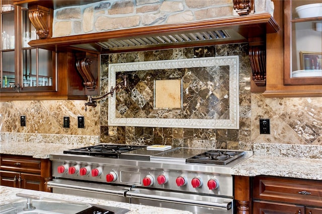 1102 Merry Water Dr, Lutz, FL 33548 - kitchen with light stone counters, decorative backsplash, double oven range, and glass insert cabinets