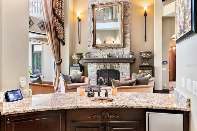 1102 Merry Water Dr, Lutz, FL 33548 - sitting room featuring a stone fireplace and arched walkways