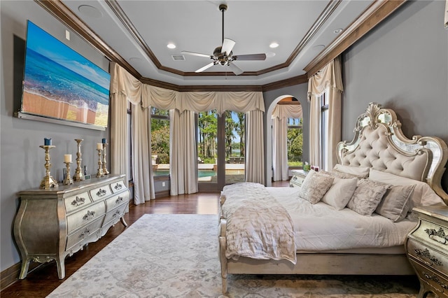 1102 Merry Water Dr, Lutz, FL 33548 - bedroom with crown molding, access to outside, arched walkways, a tray ceiling, and visible vents