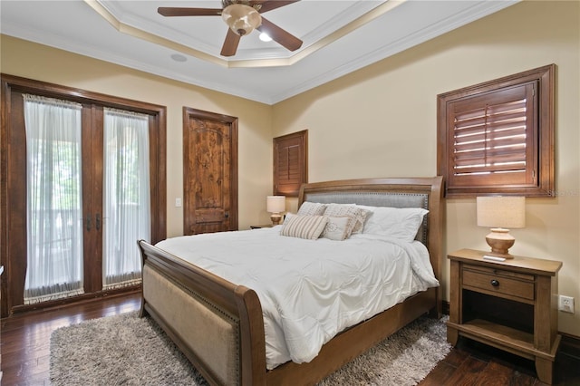 1102 Merry Water Dr, Lutz, FL 33548 - bedroom featuring crown molding, multiple windows, wood-type flooring, and a tray ceiling